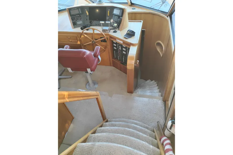 Slide: The Image of Pilothouse interior of 2002 Canoe Cove 50 Motor Yacht with steering wheel and navigation equipment. - 59