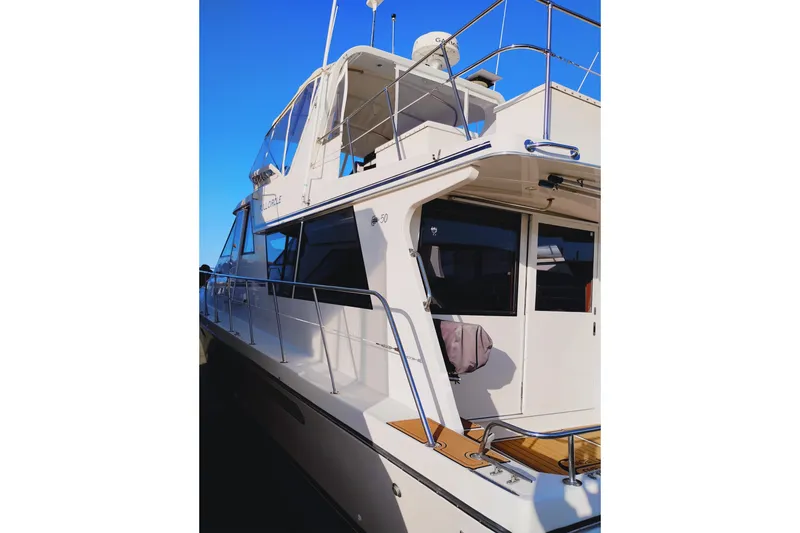 Slide: The Image of 2002 Canoe Cove 50 Pilothouse Motor Yacht with sleek design and modern features. - 6