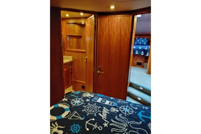 Slide: The Image of Interior of 2002 Canoe Cove 50 Pilothouse Motor Yacht with nautical-themed decor. - 66