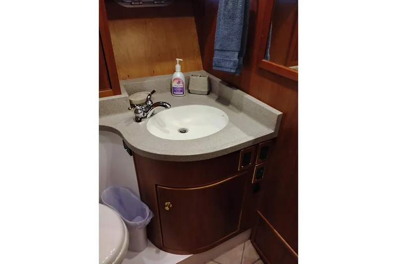 Slide: The Image of Bathroom sink area in 2002 Canoe Cove 50 Pilothouse Motor Yacht. - 69