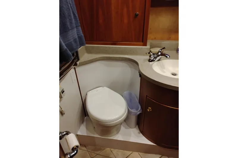 Slide: The Image of Bathroom interior of 2002 Canoe Cove 50 Pilothouse Motor Yacht, featuring toilet and sink. - 70