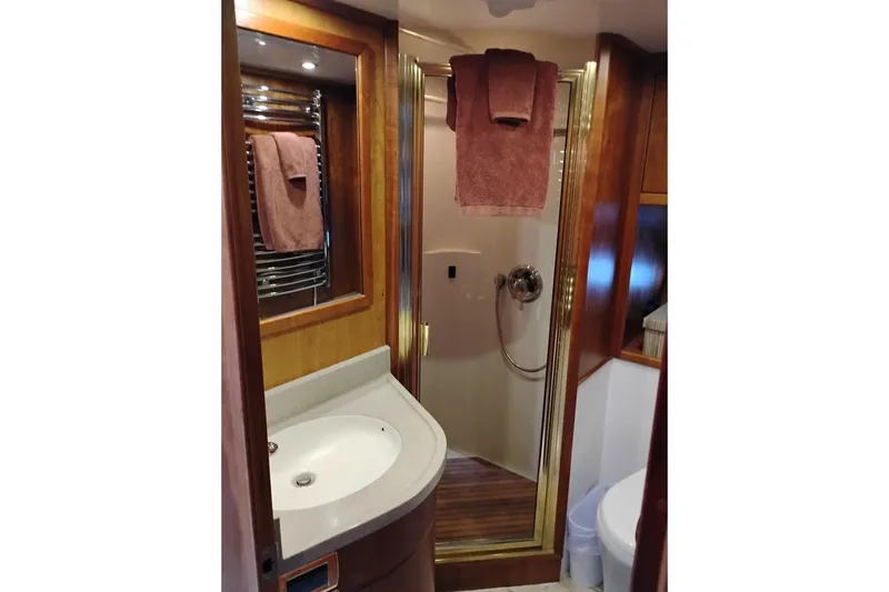 Slide: The Image of Luxurious bathroom in 2002 Canoe Cove 50 Pilothouse Motor Yacht with wood accents and modern fixtures. - 75