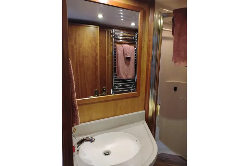 Slide: The Image of Bathroom interior of 2002 Canoe Cove 50 Pilothouse Motor Yacht with sink and mirror. - 76