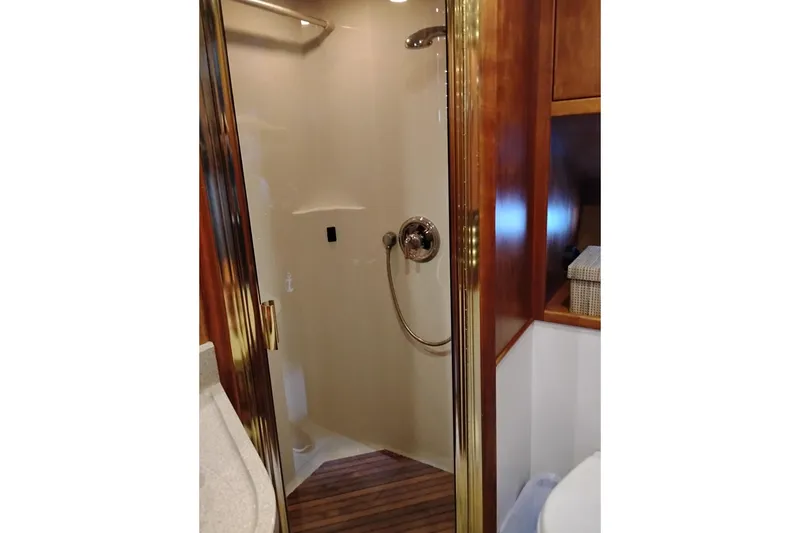 Slide: The Image of Shower area in 2002 Canoe Cove 50 Pilothouse Motor Yacht with wooden accents. - 78