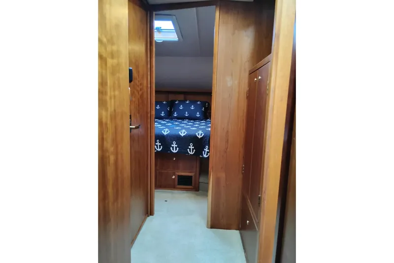 Slide: The Image of Interior cabin of 2002 Canoe Cove 50 Pilothouse Motor Yacht with nautical-themed bedding. - 79