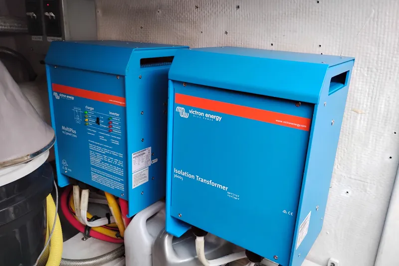 Slide: The Image of Blue Victron Energy equipment in a 2002 Canoe Cove 50 Pilothouse Motor Yacht. - 85