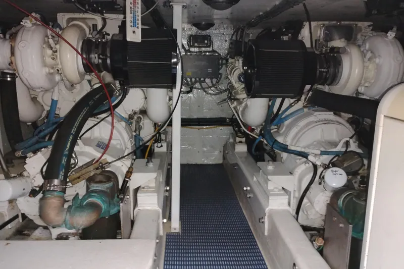Slide: The Image of Engine room of 2002 Canoe Cove 50 Pilothouse Motor Yacht, showcasing dual engines. - 89