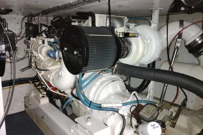 Slide: The Image of Engine room of 2002 Canoe Cove 50 Pilothouse Motor Yacht, showcasing detailed machinery. - 90