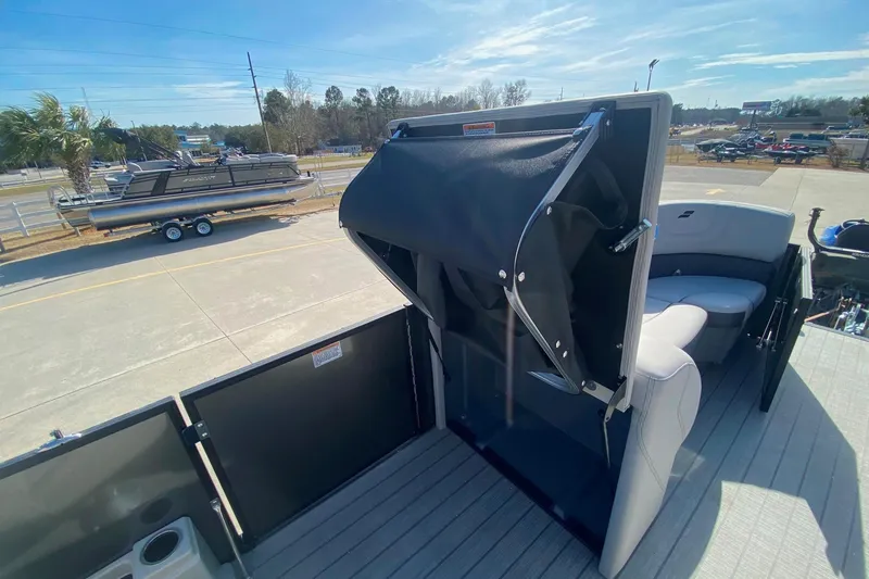 Slide: The Image of 2024 Starcraft SLS 3 pontoon boat interior with seating and storage area. - 19