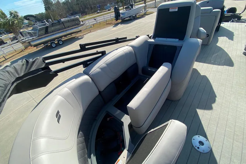 Slide: The Image of 2024 Starcraft SLS 3 boat interior with gray seating and storage compartments. - 6