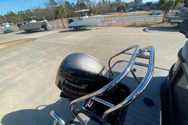 Slide: The Image of 2024 Starcraft SLS 3 boat with Yamaha outboard motor in a marina setting. - 11