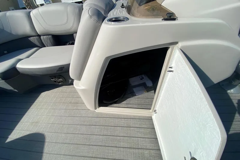 Slide: The Image of 2024 Starcraft SLS 3 boat interior with open storage compartment and seating. - 16