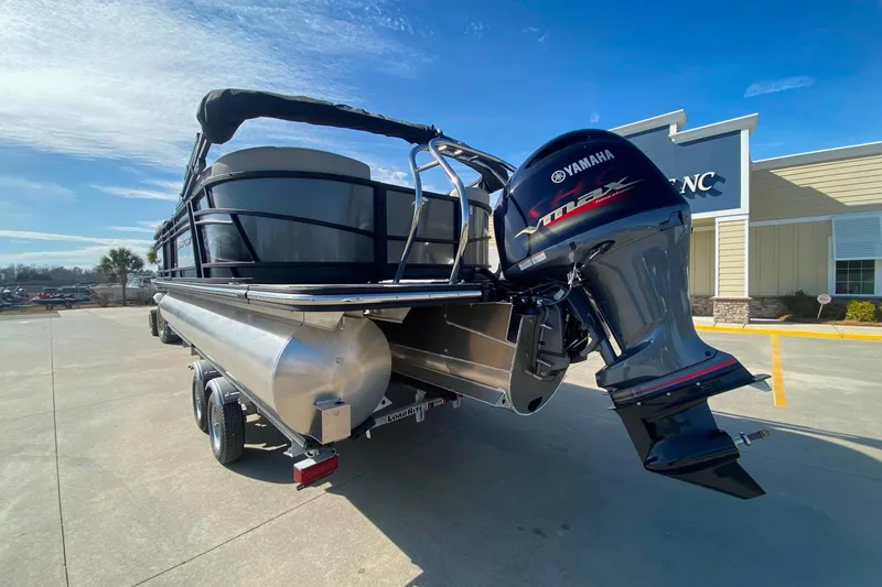 Slide: The Image of 2024 Starcraft SLS 3 pontoon boat with Yamaha outboard motor on trailer. - 4