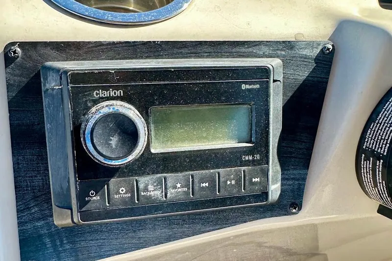 Slide: The Image of Clarion CMM-20 stereo system on 2023 Harris Cruiser 230 boat dashboard. - 19