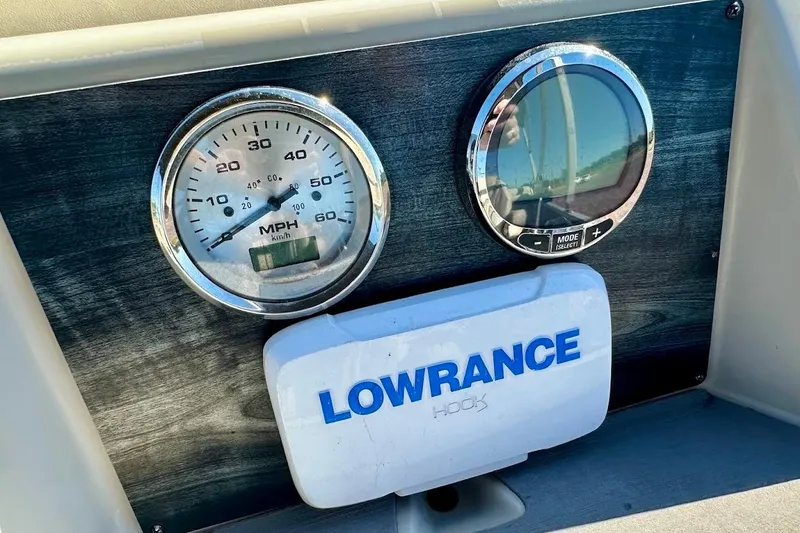 Slide: The Image of Dashboard of 2023 Harris Cruiser 230 with speedometer and Lowrance device. - 20
