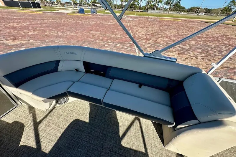 Slide: The Image of 2023 Harris Cruiser 230 boat interior with plush seating and modern design. - 24