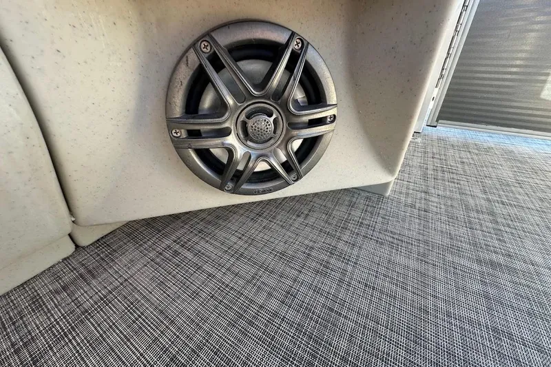 Slide: The Image of 2023 Harris Cruiser 230 boat speaker on textured flooring. - 25