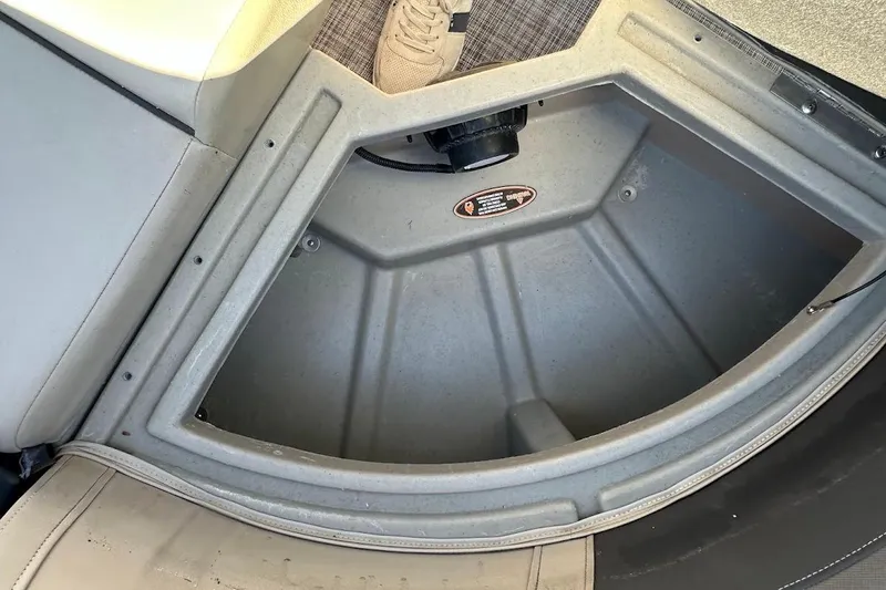 Slide: The Image of 2023 Harris Cruiser 230 storage compartment with open lid and visible interior details. - 33