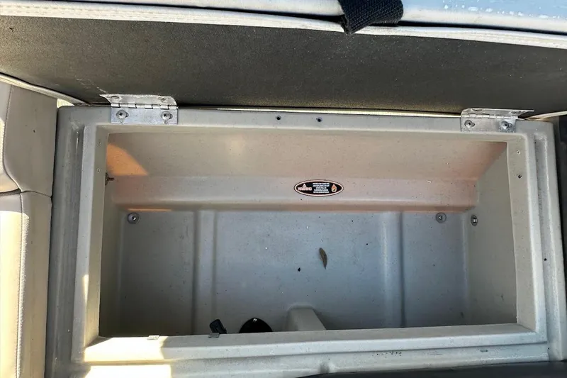 Slide: The Image of Open storage compartment in 2023 Harris Cruiser 230 boat. - 35