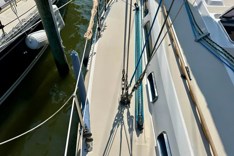 Slide: The Image of Deck view of a 2002 Sabre 402 sailboat with rigging and dock. - 10