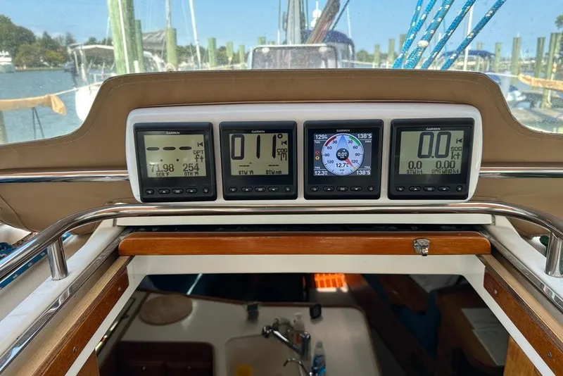 Slide: The Image of Control panel of a 2002 Sabre 402 sailboat with Garmin navigation displays. - 18