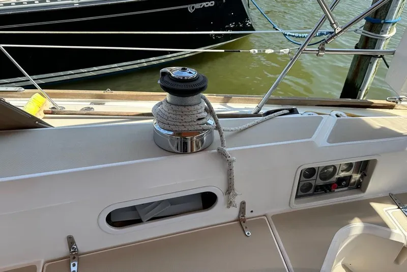 Slide: The Image of 2002 Sabre 402 sailboat deck with winch and control panel. - 19