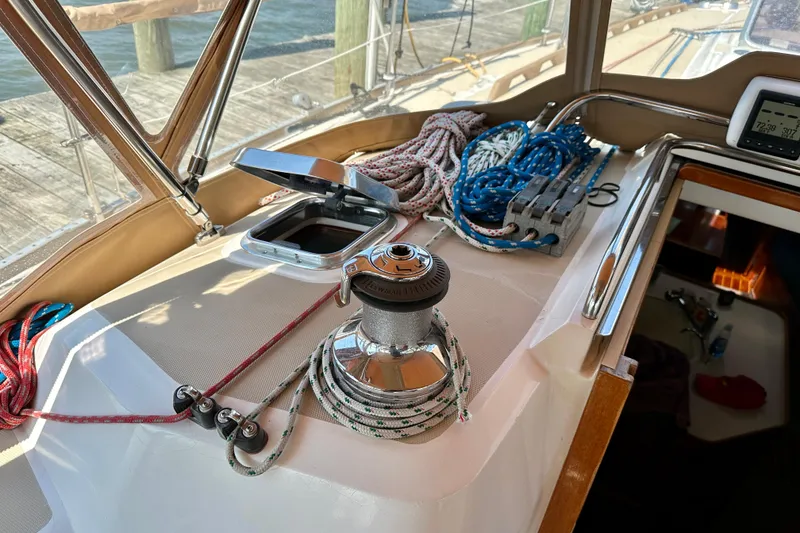Slide: The Image of Deck of 2002 Sabre 402 sailboat with winch, ropes, and navigation equipment. - 22