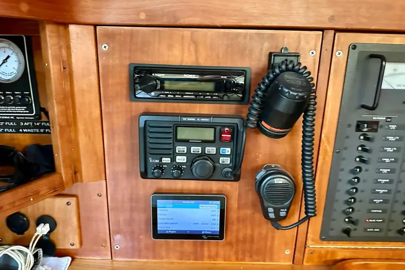 Slide: The Image of Control panel of a 2002 Sabre 402 yacht with radio and navigation equipment. - 34