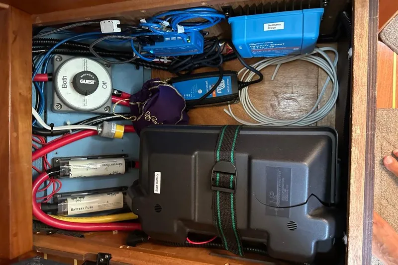 Slide: The Image of Electrical system components in a 2002 Sabre 402 boat, featuring battery fuses and wiring. - 48