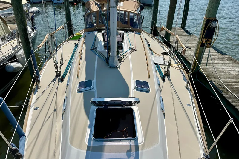 Slide: The Image of 2002 Sabre 402 sailboat docked at marina, open hatch, clear sunny day. - 6