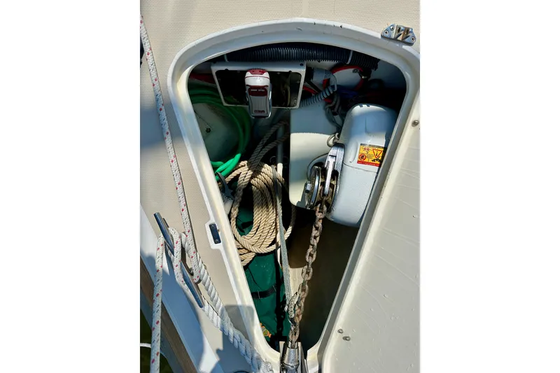 Slide: The Image of Anchor locker of 2002 Sabre 402 sailboat with ropes and chain. - 9