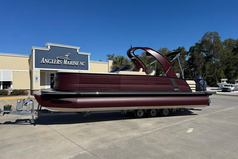 The Image of 2026 Starcraft RX 25 Q DC pontoon boat at Anglers Marine NC dealership. - 1