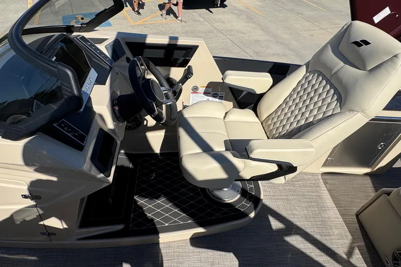 Slide: The Image of Luxurious helm of 2026 Starcraft RX 25 Q DC boat with plush seating. - 10