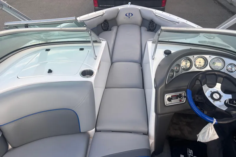 Slide: The Image of 2005 Supra Launch 22 SSV boat interior with steering wheel and dashboard controls. - 10