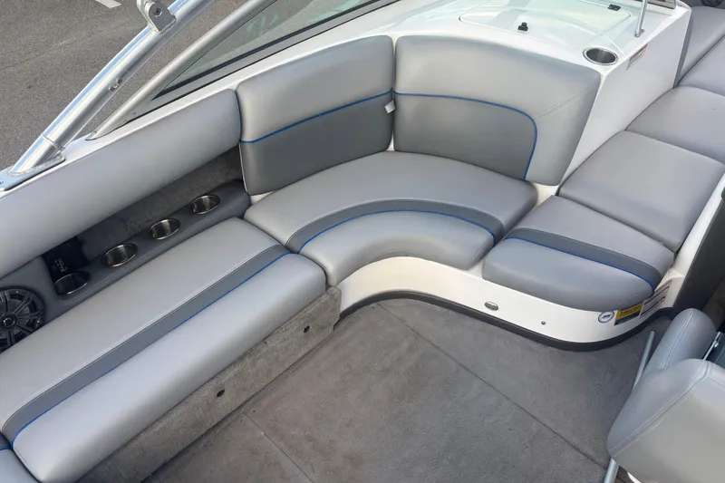 Slide: The Image of 2005 Supra Launch 22 SSV boat interior with gray seating and cup holders. - 11