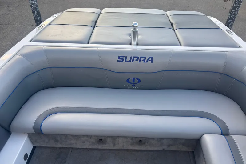 Slide: The Image of 2005 Supra Launch 22 SSV boat interior with gray seating and blue accents. - 8