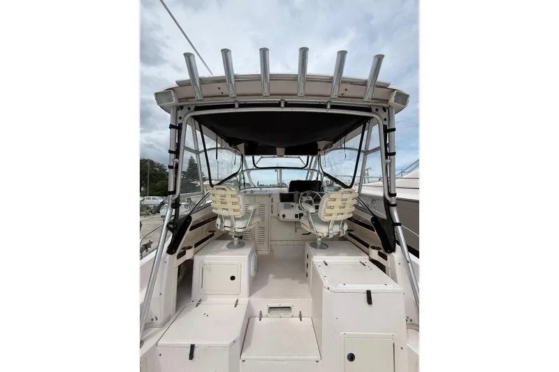Slide: The Image of 2001 Grady-White Marlin 300 boat interior with helm and seating area. - 15
