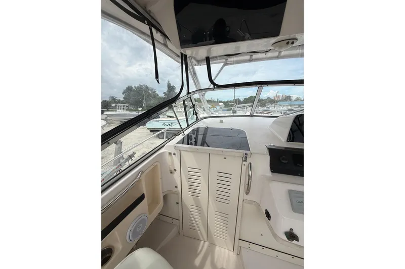 Slide: The Image of 2001 Grady-White Marlin 300 boat interior with helm and dashboard view. - 22