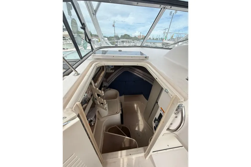 Slide: The Image of 2001 Grady-White Marlin 300 cabin interior with seating and storage. - 23