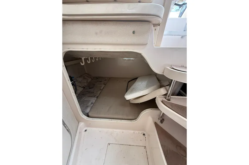 Slide: The Image of 2001 Grady-White Marlin 300 cabin interior with seating and storage space. - 27
