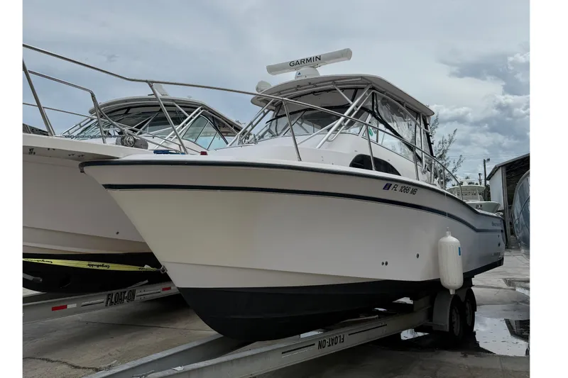 Slide: The Image of 2001 Grady-White Marlin 300 boat on trailer, featuring Garmin equipment. - 30