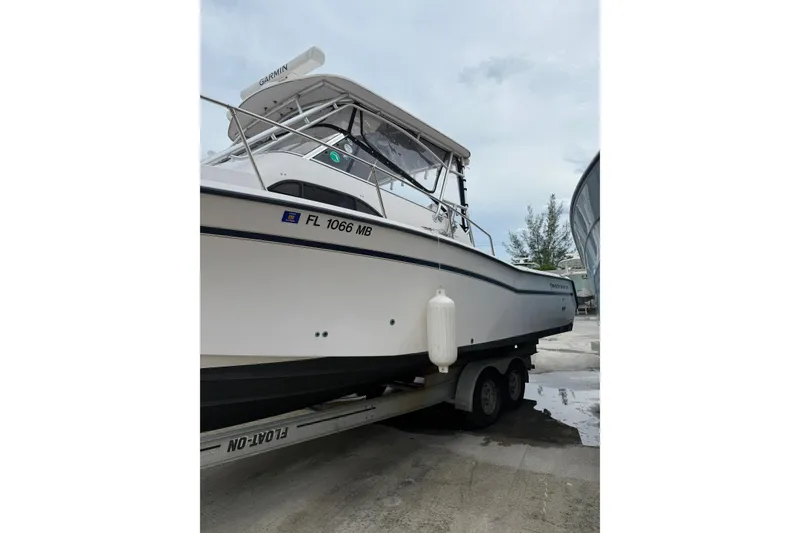 Slide: The Image of 2001 Grady-White Marlin 300 boat on trailer, side view, with Garmin equipment. - 31