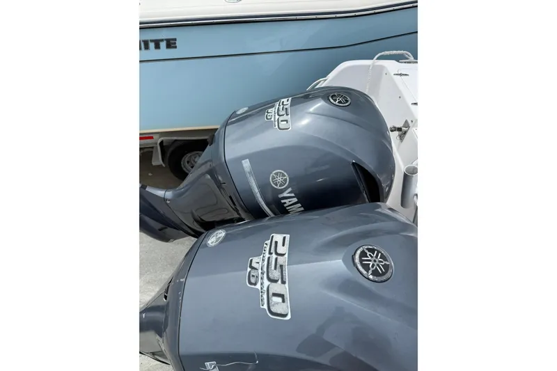 Slide: The Image of Twin Yamaha 250 outboard motors on a 2001 Grady-White Marlin 300 boat. - 9