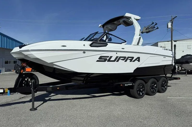 Slide: The Image of 2026 Supra SE engine compartment with Raptor branding and safety equipment. - 5