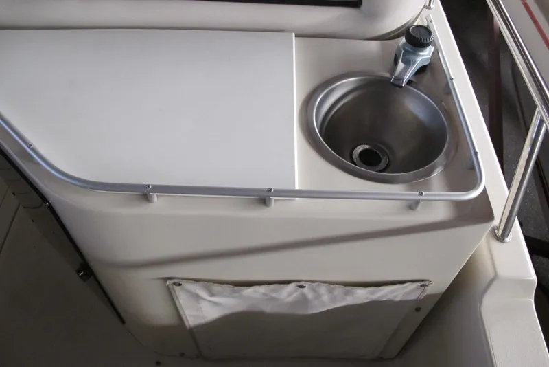 Slide: The Image of 1995 Harris FloteBote Legend 240 boat sink and counter area. - 10