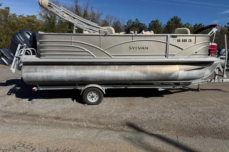 The Image of 2018 Sylvan Mirage Fish 8520 4-PT pontoon boat on trailer, side view. - 1
