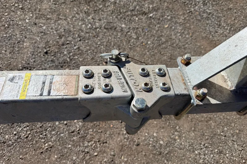 Slide: The Image of Trailer hitch of 2018 Sylvan Mirage Fish 8520 4-PT on gravel surface. - 11