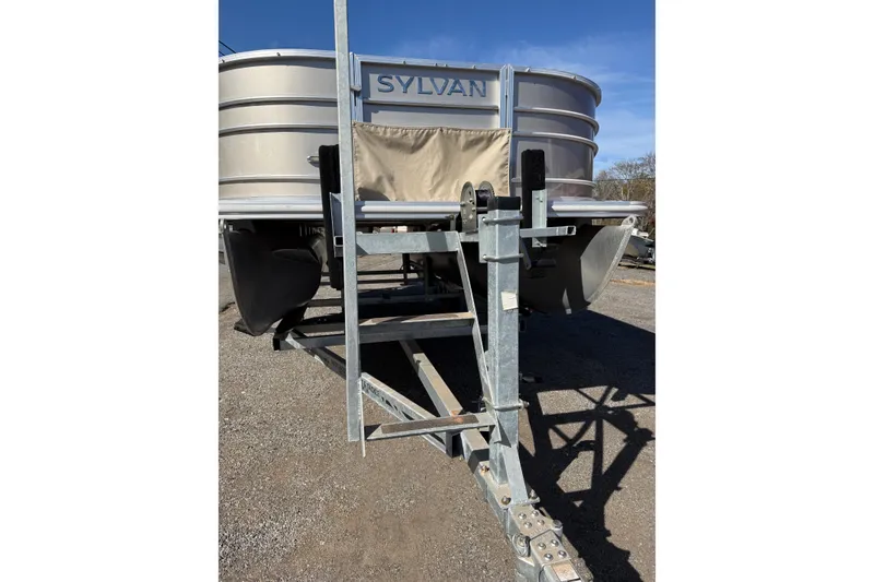 Slide: The Image of 2018 Sylvan Mirage Fish 8520 4-PT pontoon boat on trailer, front view. - 12