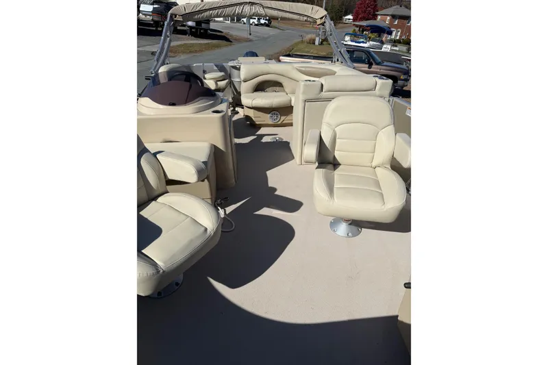 Slide: The Image of 2018 Sylvan Mirage Fish 8520 4-PT pontoon boat with beige seating and canopy. - 13