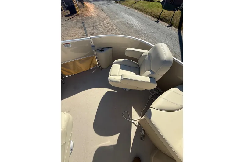 Slide: The Image of 2018 Sylvan Mirage Fish 8520 4-PT boat interior with beige seating and deck. - 15